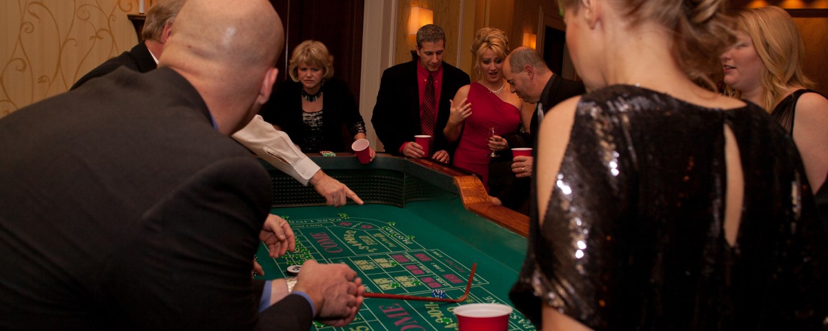 Seattle Casino Party dealer showing patrons how to play